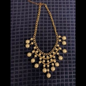 Gold and pearl statement necklace.